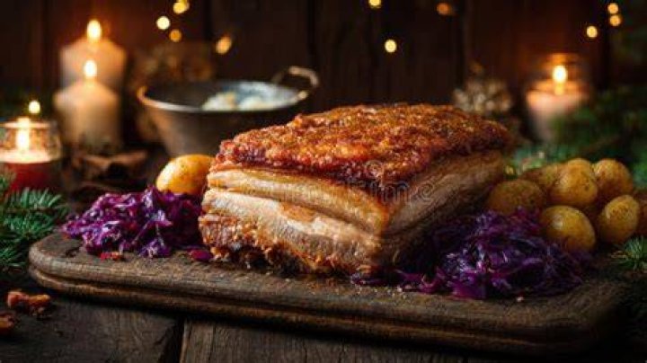 Meat served with crackling, perhaps Universal Crossword Clue - News